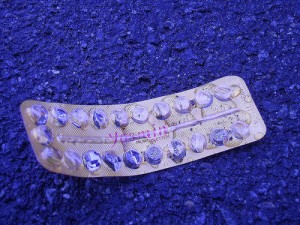 Empty birth control pill packet in the street