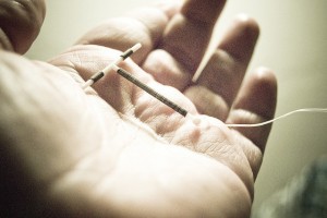 IUD in palm of woman's hand